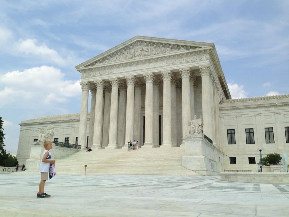 Visitors gathered on the plaza and steps outside the Supreme Court Building.