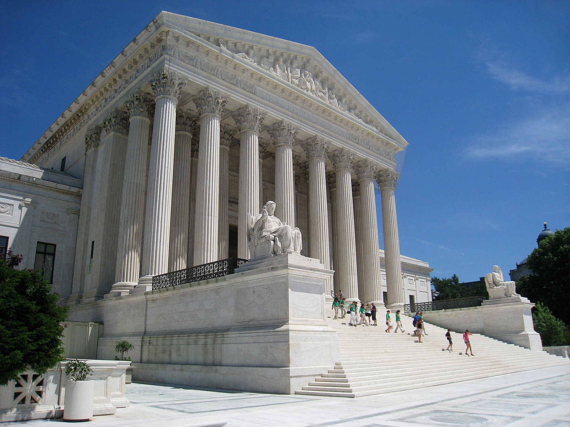 A row of marble Corinthian columns along the facade of the Supreme Court Building.